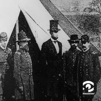 Lincoln stands in front of a tent with several other Army officers.