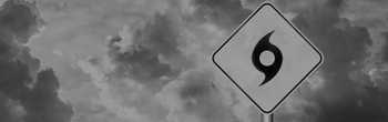 cover image of cloudy sky with hurricane evacuation sign